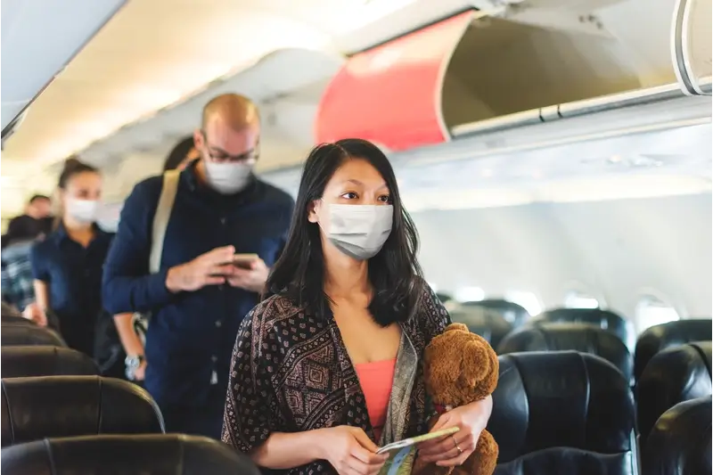 How To Avoid Getting Sick On A Plane: Using Mask